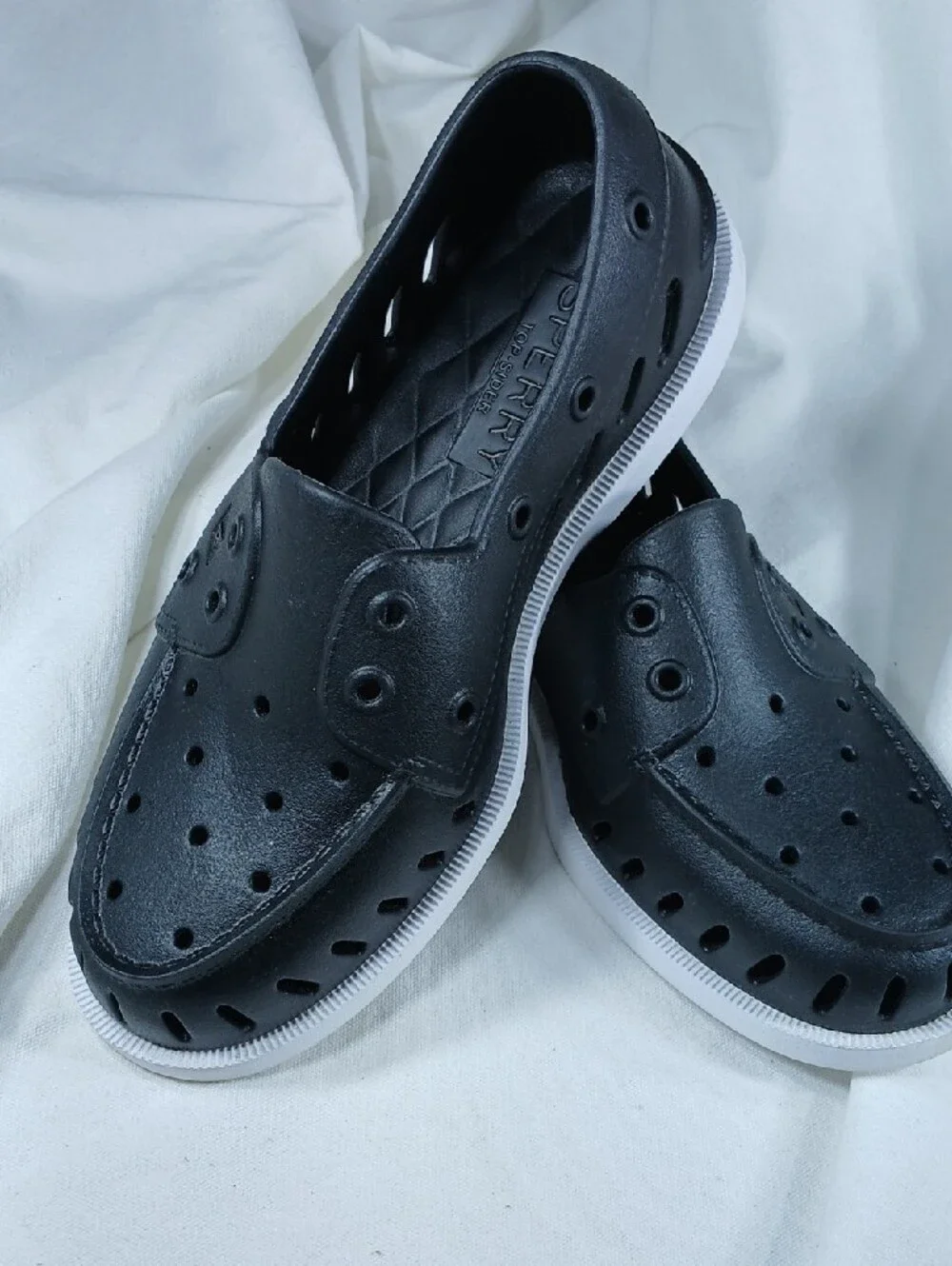 Sperry Black Perforated Slip-On Boat Shoes with White Sole